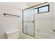 A bathroom with tile flooring, a bath tub, a sliding glass door, and a towel rack at 1813 E Sheena Dr, Phoenix, AZ 85022