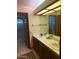Bathroom with double sinks and shower/tub combo, and a large mirror at 1813 E Sheena Dr, Phoenix, AZ 85022