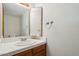 Bathroom features a white tiled countertop and wooden cabinet at 1813 E Sheena Dr, Phoenix, AZ 85022