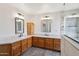 The Primary bathroom features a long vanity, granite countertops, and a custom glass enclosed shower at 1813 E Sheena Dr, Phoenix, AZ 85022