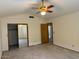 Large bedroom with a fan and spacious closet with sliding mirror doors at 1813 E Sheena Dr, Phoenix, AZ 85022