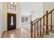 Bright foyer featuring tile flooring, a staircase, and large windows providing ample natural light at 1813 E Sheena Dr, Phoenix, AZ 85022