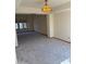 Bright open-concept living area with lots of natural light and new carpeting at 1813 E Sheena Dr, Phoenix, AZ 85022