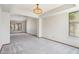 Spacious living area with large windows and neutral carpet at 1813 E Sheena Dr, Phoenix, AZ 85022