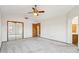 Spacious primary bedroom with mirrored closet doors and neutral carpet at 1813 E Sheena Dr, Phoenix, AZ 85022