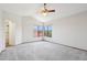 Spacious bedroom features vaulted ceiling, ceiling fan, and large windows with picturesque views at 1813 E Sheena Dr, Phoenix, AZ 85022