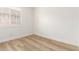 A minimal room featuring plantation shutters and wood floors at 18614 E Oriole Way, Queen Creek, AZ 85142