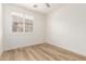 A clean bedroom featuring wood floors at 18614 E Oriole Way, Queen Creek, AZ 85142