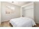Cozy bedroom with a murphy bed and plantation shutters at 18614 E Oriole Way, Queen Creek, AZ 85142