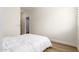 A light-filled bedroom with a clean aesthetic and a view to the ensuite at 18614 E Oriole Way, Queen Creek, AZ 85142