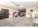 Spacious garage providing ample storage, overhead lighting, and an automatic garage door at 18614 E Oriole Way, Queen Creek, AZ 85142
