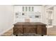 View of a modern home office featuring custom shelving and statement desk at 18614 E Oriole Way, Queen Creek, AZ 85142