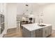 Open-concept kitchen seamlessly connects to the dining and living areas, perfect for entertaining at 18614 E Oriole Way, Queen Creek, AZ 85142