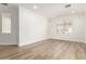 Bright living room with hardwood floors, ample natural light, and a modern aesthetic at 18614 E Oriole Way, Queen Creek, AZ 85142