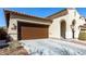 Single-story home showcasing a spacious driveway, xeriscaping, and a garage at 20496 W Valley View Dr, Buckeye, AZ 85396