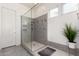 Modern glass shower with gray tile and built-in niche at 20496 W Valley View Dr, Buckeye, AZ 85396