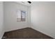 Simple bedroom with neutral carpet, fresh paint, and a bright window that provides natural light at 20823 S 185Th Way, Queen Creek, AZ 85142