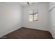 Simple bedroom with neutral carpet, fresh paint, and a bright window that provides natural light at 20823 S 185Th Way, Queen Creek, AZ 85142