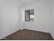 Cozy bedroom with neutral carpet, fresh paint, and a bright window that provides natural light at 20823 S 185Th Way, Queen Creek, AZ 85142