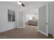 Bright room featuring wood floors, a ceiling fan, and frosted french doors that provide an open and airy feel at 20823 S 185Th Way, Queen Creek, AZ 85142