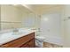 Bathroom featuring a sink, marble countertop, updated fixtures and a well maintained tub at 2164 S Estrella Cir, Mesa, AZ 85202