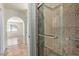 Modern bathroom featuring a glass-enclosed shower with stylish tile and updated fixtures at 2164 S Estrella Cir, Mesa, AZ 85202