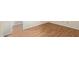 Hardwood flooring in bedroom with view into entry hall at 2164 S Estrella Cir, Mesa, AZ 85202
