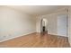 Large bedroom features wood-look flooring and an entrance to the ensuite at 2164 S Estrella Cir, Mesa, AZ 85202