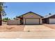 Charming single-level home with a two-car garage and desert landscaping at 2164 S Estrella Cir, Mesa, AZ 85202