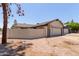 Single level home showing the garage and courtyard wall at 2164 S Estrella Cir, Mesa, AZ 85202