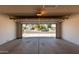 Spacious garage with an open door providing access to the street and neighborhood at 2164 S Estrella Cir, Mesa, AZ 85202