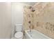 Full bathroom featuring tile surround and updated fixtures at 2301 E University Dr # 172, Mesa, AZ 85213