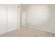 Carpeted bedroom with a double-door closet, fresh paint, and a neutral color scheme at 2301 E University Dr # 172, Mesa, AZ 85213