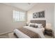 Cozy bedroom features plush carpeting, a queen-size bed with decorative pillows, and a neutral color palette at 2301 E University Dr # 172, Mesa, AZ 85213