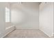 Neutral bedroom featuring a window bench and plush carpet at 2301 E University Dr # 172, Mesa, AZ 85213