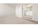 Carpeted bedroom with view of bathroom and walk-in closet at 2301 E University Dr # 172, Mesa, AZ 85213