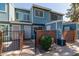 Blue two-story home featuring brick accents, gated entry and well-maintained landscaping at 2301 E University Dr # 172, Mesa, AZ 85213