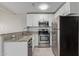 Well-equipped kitchen featuring granite countertops and stainless steel appliances at 2301 E University Dr # 172, Mesa, AZ 85213