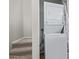 Convenient laundry area equipped with a stacked washer and dryer at 2301 E University Dr # 172, Mesa, AZ 85213
