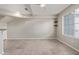 Bright, open-concept living and kitchen area with neutral walls and tile flooring at 2301 E University Dr # 172, Mesa, AZ 85213