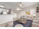 Modern living room with adjacent kitchen space, neutral tones and comfortable seating at 2301 E University Dr # 172, Mesa, AZ 85213