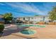 Community swimming pool with a hot tub and lounge chairs perfect for relaxing poolside at 2301 E University Dr # 172, Mesa, AZ 85213