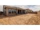 The expansive backyard features a covered patio and space for landscaping and outdoor activities at 23036 E Oriole Way, Queen Creek, AZ 85142