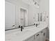Bright bathroom with dual sinks, white cabinets, and modern fixtures, creating a spa-like retreat at 23036 E Oriole Way, Queen Creek, AZ 85142