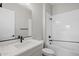 Modern bathroom features a white vanity, a full tub and shower combination, and a toilet at 23036 E Oriole Way, Queen Creek, AZ 85142