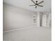 An empty bedroom is bright, clean, and ready for move in, with neutral carpet and a ceiling fan at 23036 E Oriole Way, Queen Creek, AZ 85142