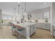 Modern kitchen featuring stainless steel appliances, a large island, and an eat-in bar at 23036 E Oriole Way, Queen Creek, AZ 85142