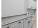 Spacious laundry room features modern cabinets, lots of counter space and neutral walls at 23036 E Oriole Way, Queen Creek, AZ 85142
