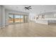 Spacious living room featuring hardwood floors and sliding glass doors to the backyard at 23036 E Oriole Way, Queen Creek, AZ 85142