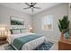 Stylishly decorated main bedroom with bright windows, ceiling fan, and cozy decor at 23036 E Oriole Way, Queen Creek, AZ 85142